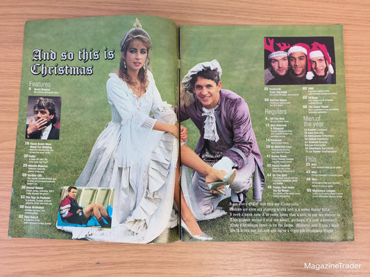 Open magazine on a wooden surface with vintage-style images and text.